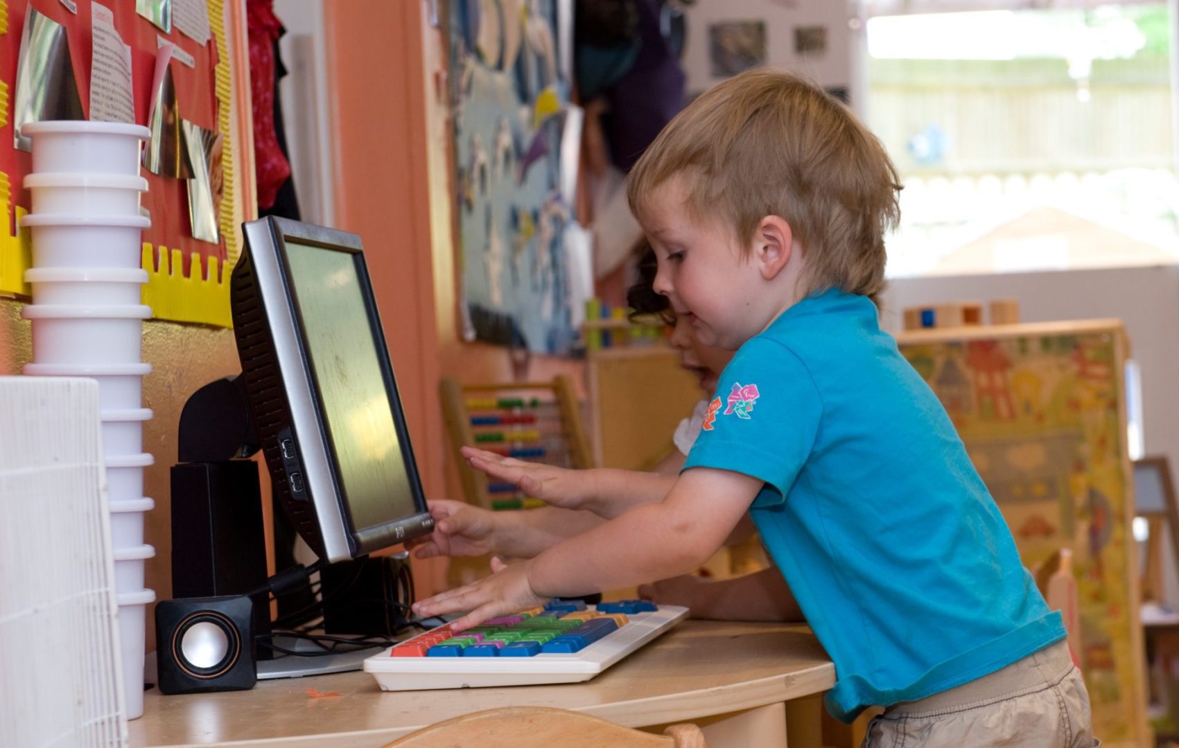 Child with toy computer