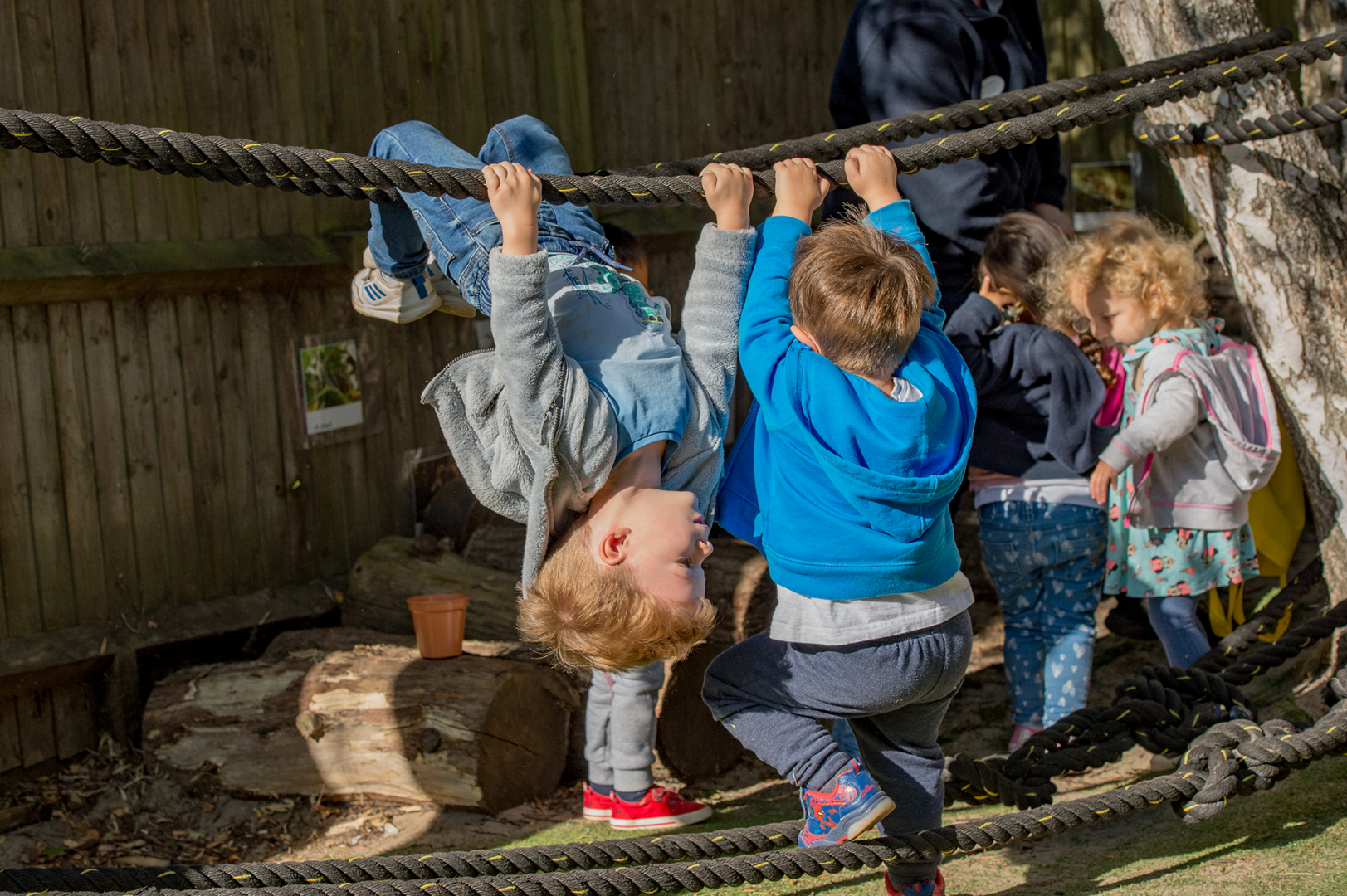 Children playing on a rope safely