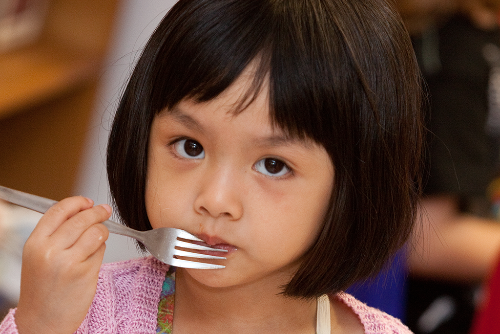 Child eating with a fork